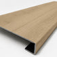 Custom square-nose stair tread made from NuCore Cedar Point flooring. Square profile. Angled view.