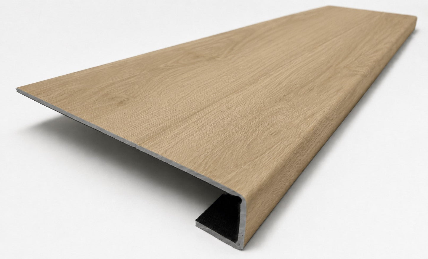 Custom square-nose stair tread made from NuCore Cedar Point flooring. Square profile. Angled view.