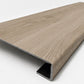 Custom square-nose stair tread made to match NuCore Deerfield Grove flooring. Square profile. Angled view.