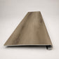 Custom round-nose stair tread made from NuCore Everwood Falls flooring. Round profile. Front view.