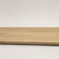 Custom round-nose stair tread made to match NuCore Fairborn Blonde flooring. Round profile. Full view.