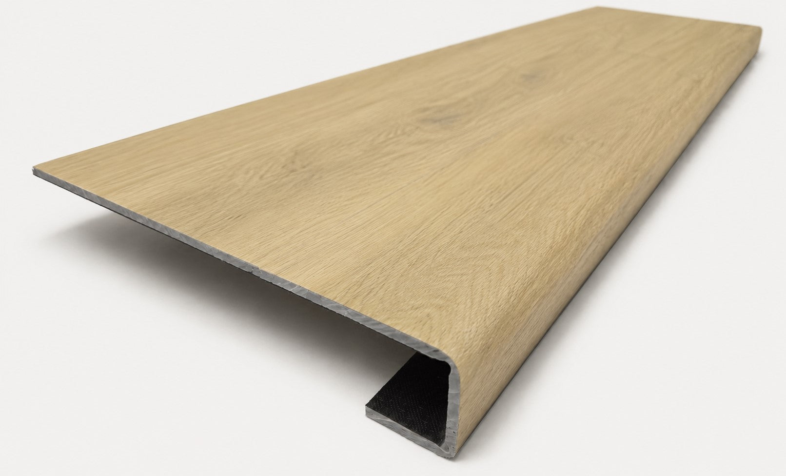 Custom square-nose stair tread made to match NuCore Fairborn Blonde flooring. Square profile. Angled view.