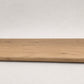 Custom round-nose stair tread made from NuCore Glenridge Oak flooring. Round profile. Full view.