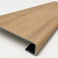 Custom square-nose stair tread made from NuCore Glenridge Oak flooring. Square profile. Angled view.