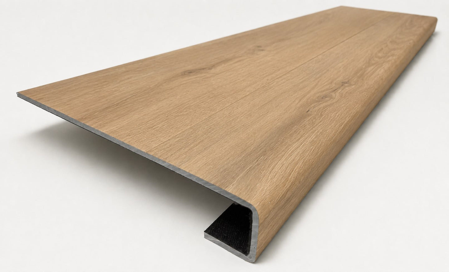 Custom square-nose stair tread made from NuCore Glenridge Oak flooring. Square profile. Angled view.