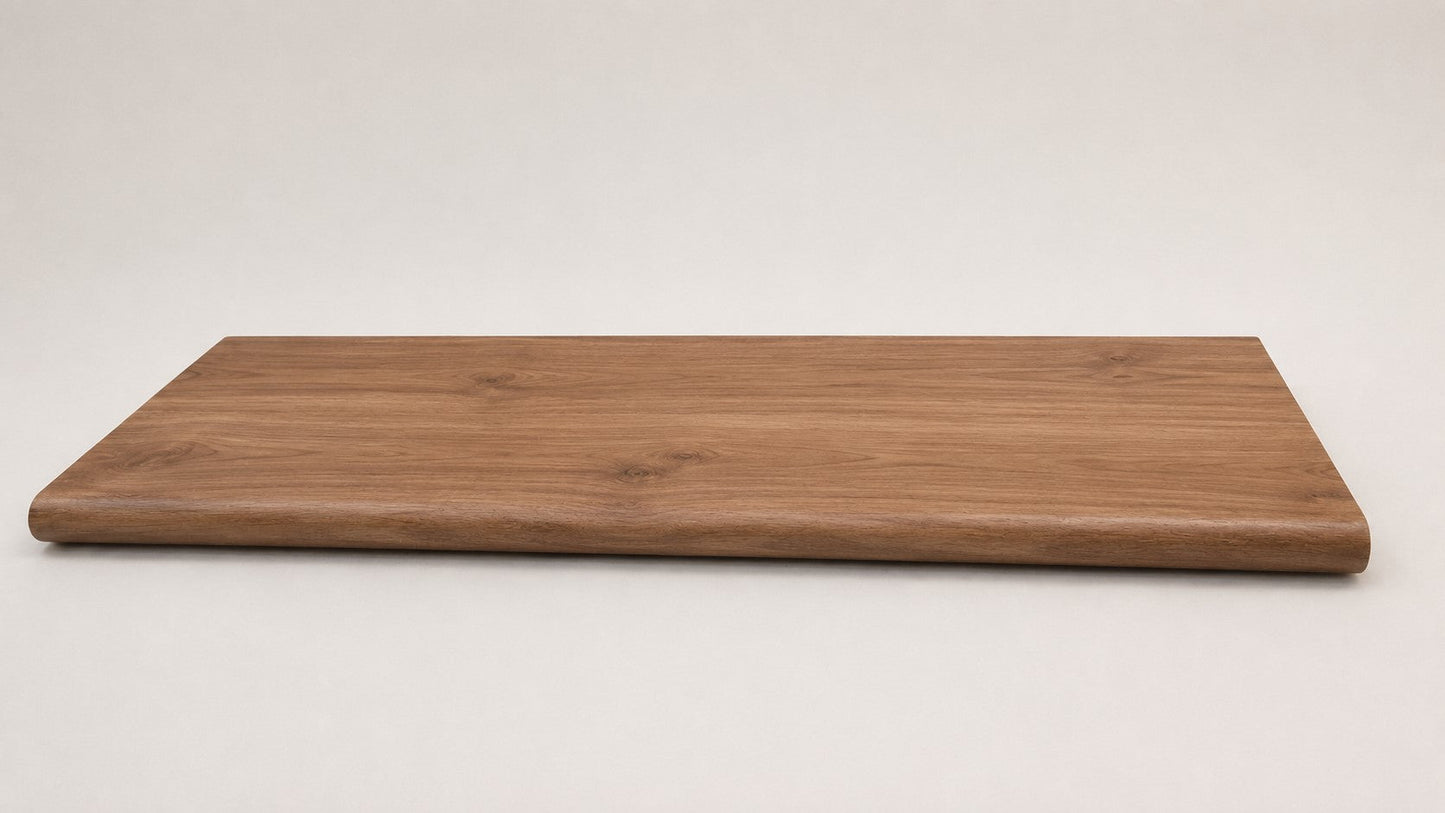 Custom round-nose stair tread made from NuCore Gunstock Oak flooring. Round profile. Full view.