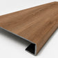 Custom square-nose stair tread made from NuCore Gunstock Oak flooring. Square profile. Angled view.