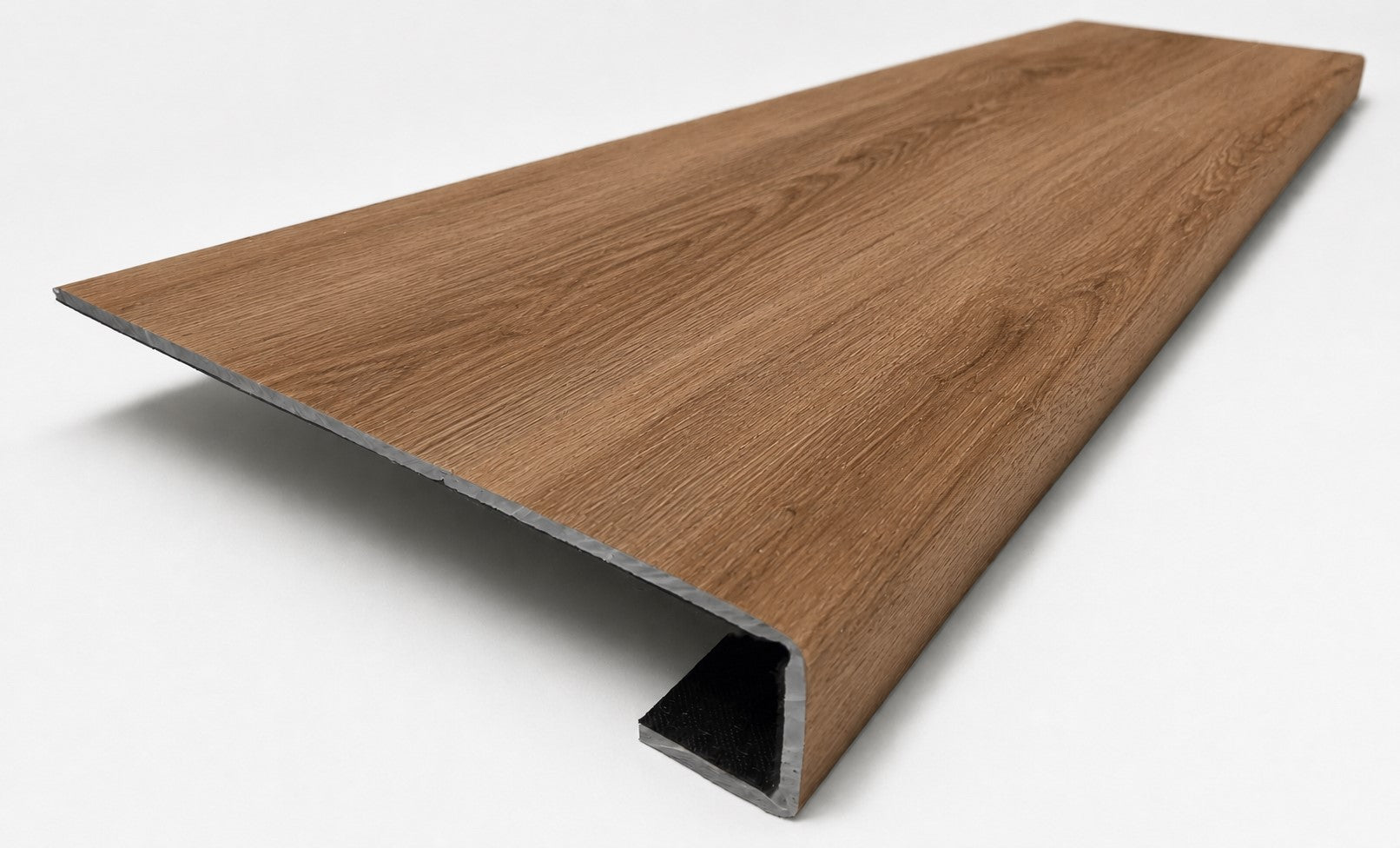 Custom square-nose stair tread made from NuCore Gunstock Oak flooring. Square profile. Angled view.