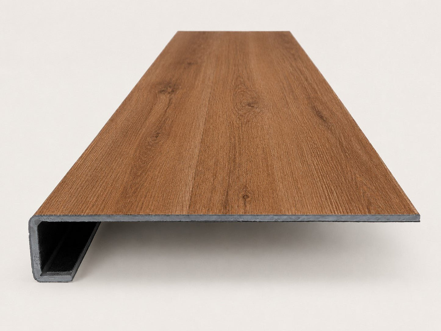 Custom square-nose stair tread made from NuCore Gunstock Oak flooring. Square profile. Front view