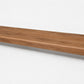 Custom square-nose stair tread made from NuCore Gunstock Oak flooring. Square profile. Full view.