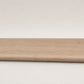 Custom round-nose stair tread made from NuCore Nordic Oak flooring. Round profile. Full view.