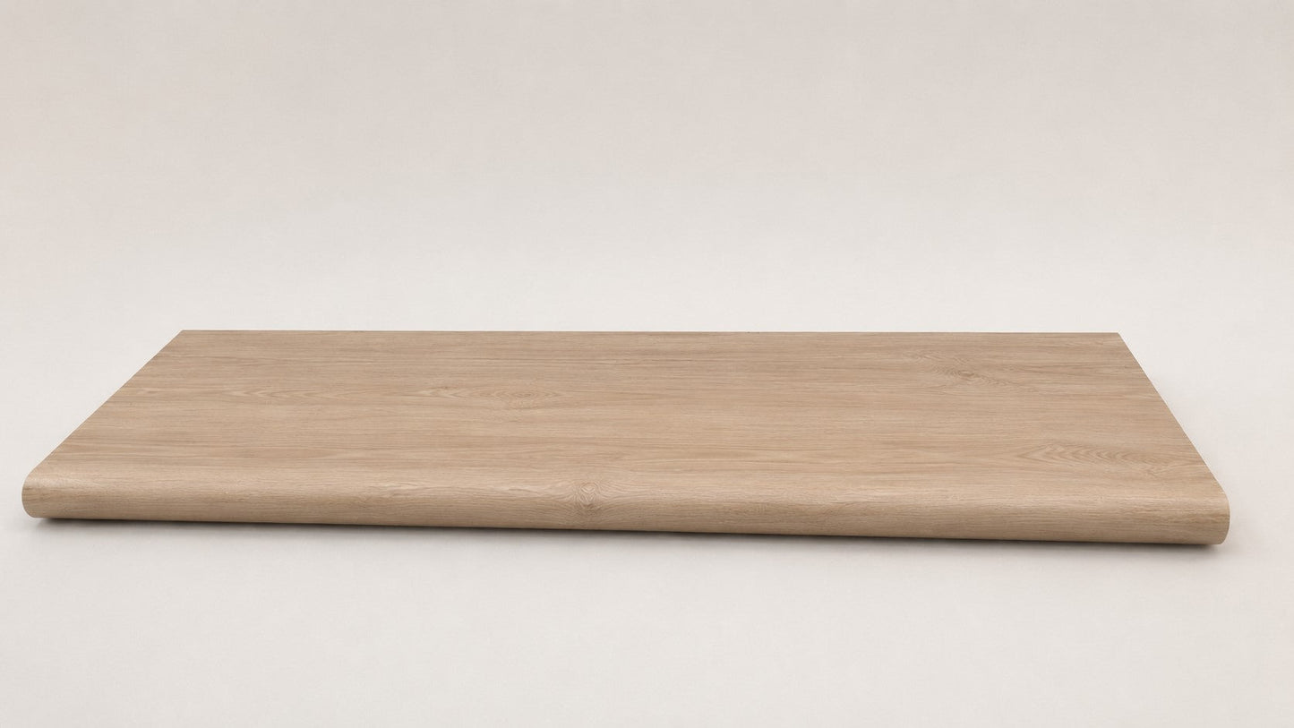 Custom round-nose stair tread made from NuCore Nordic Oak flooring. Round profile. Full view.