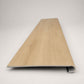 Custom round-nose stair tread made from NuCore Oakleigh Blonde flooring. Round profile. Front view.