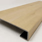 Custom square-nose stair tread made from NuCore Oakleigh Blonde flooring. Square profile. Angled view.