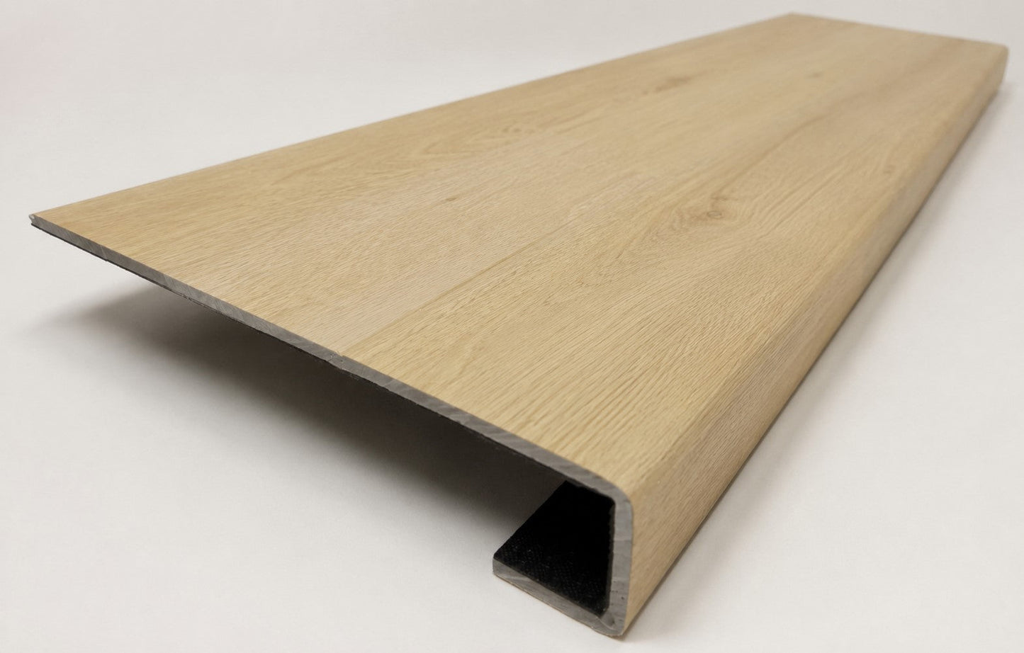 Custom square-nose stair tread made from NuCore Oakleigh Blonde flooring. Square profile. Angled view.