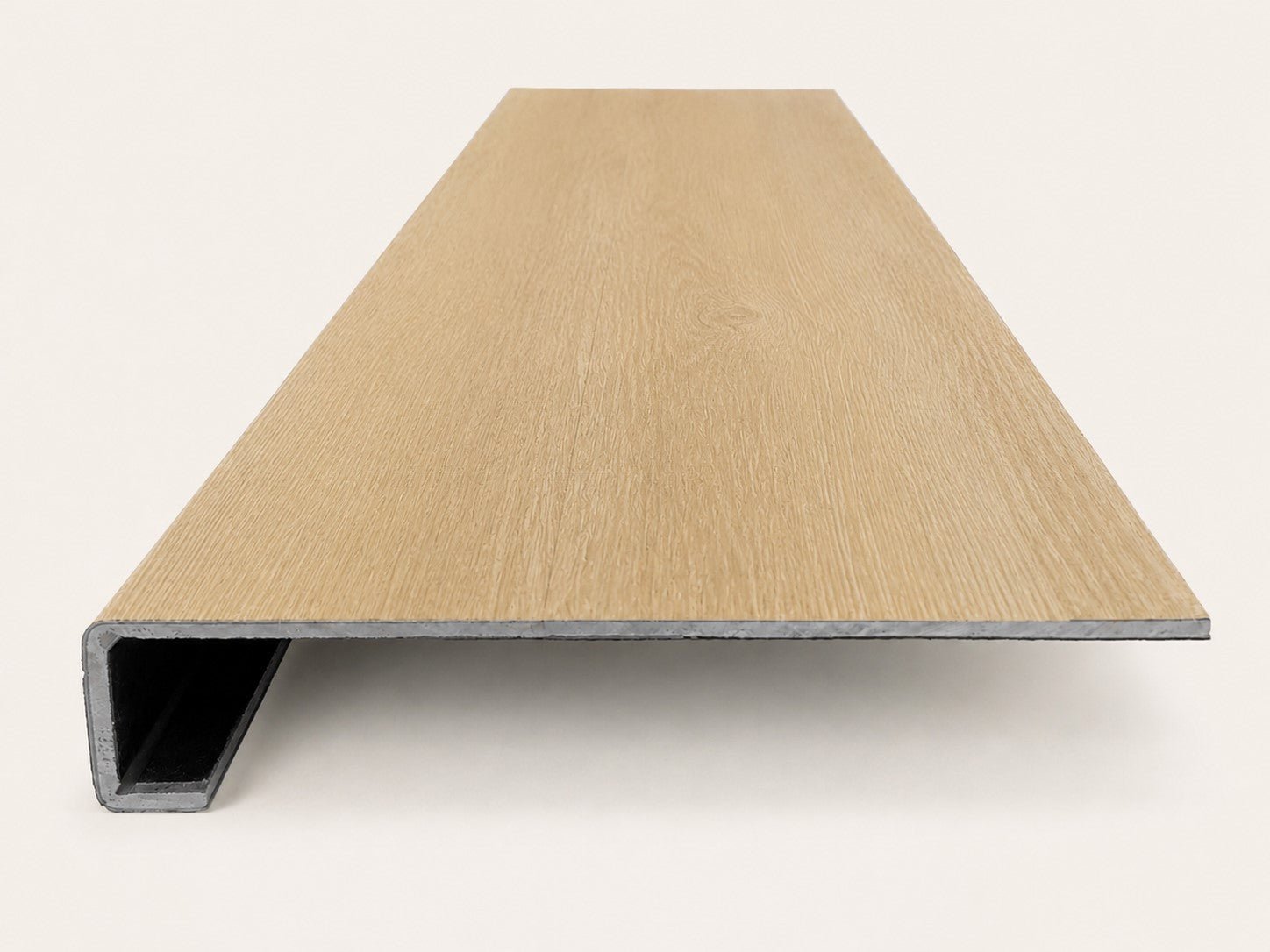 Custom square-nose stair tread made from NuCore Oakleigh Blonde flooring. Square profile. Front view.