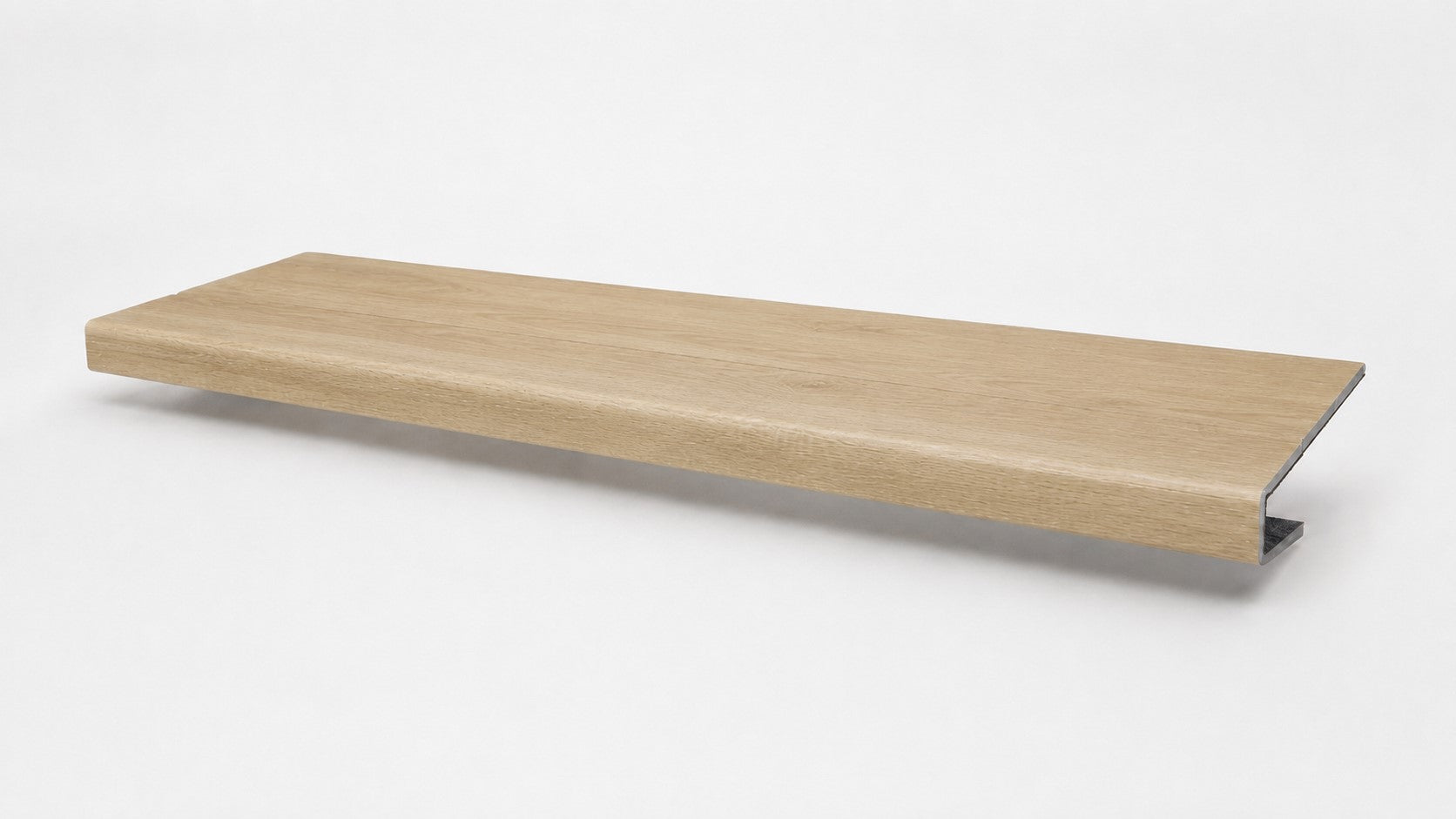 Custom square-nose stair tread made from NuCore Oakleigh Blonde flooring. Square profile. Front view.