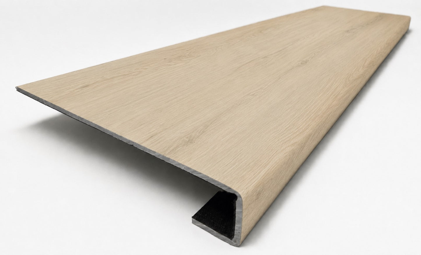 Custom square-nose stair tread made from NuCore Sandbank Point flooring. Square profile. Angled view.