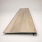 Custom round-nose stair tread made to match NuCore Turner Road flooring. Round profile. Front view.