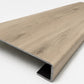 Custom square-nose stair tread made to match NuCore Turner Road flooring. Square profile. Angled view.