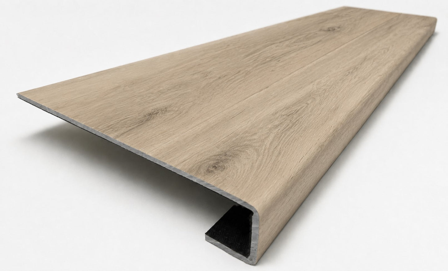 Custom square-nose stair tread made to match NuCore Turner Road flooring. Square profile. Angled view.