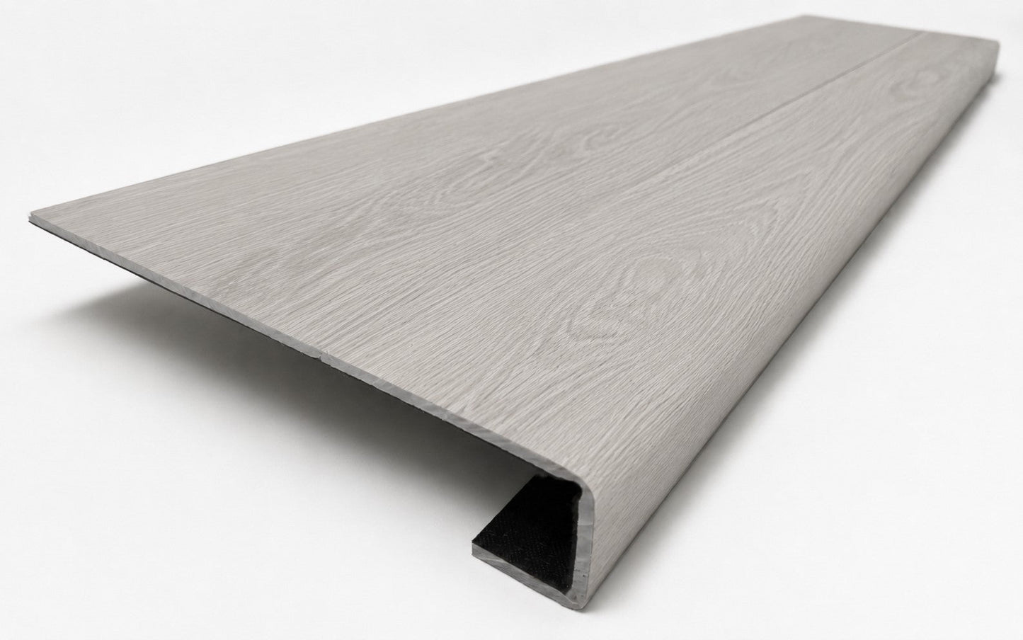 Custom square-nose stair tread made from NuCore Wisteria flooring. Square profile. Angled view.