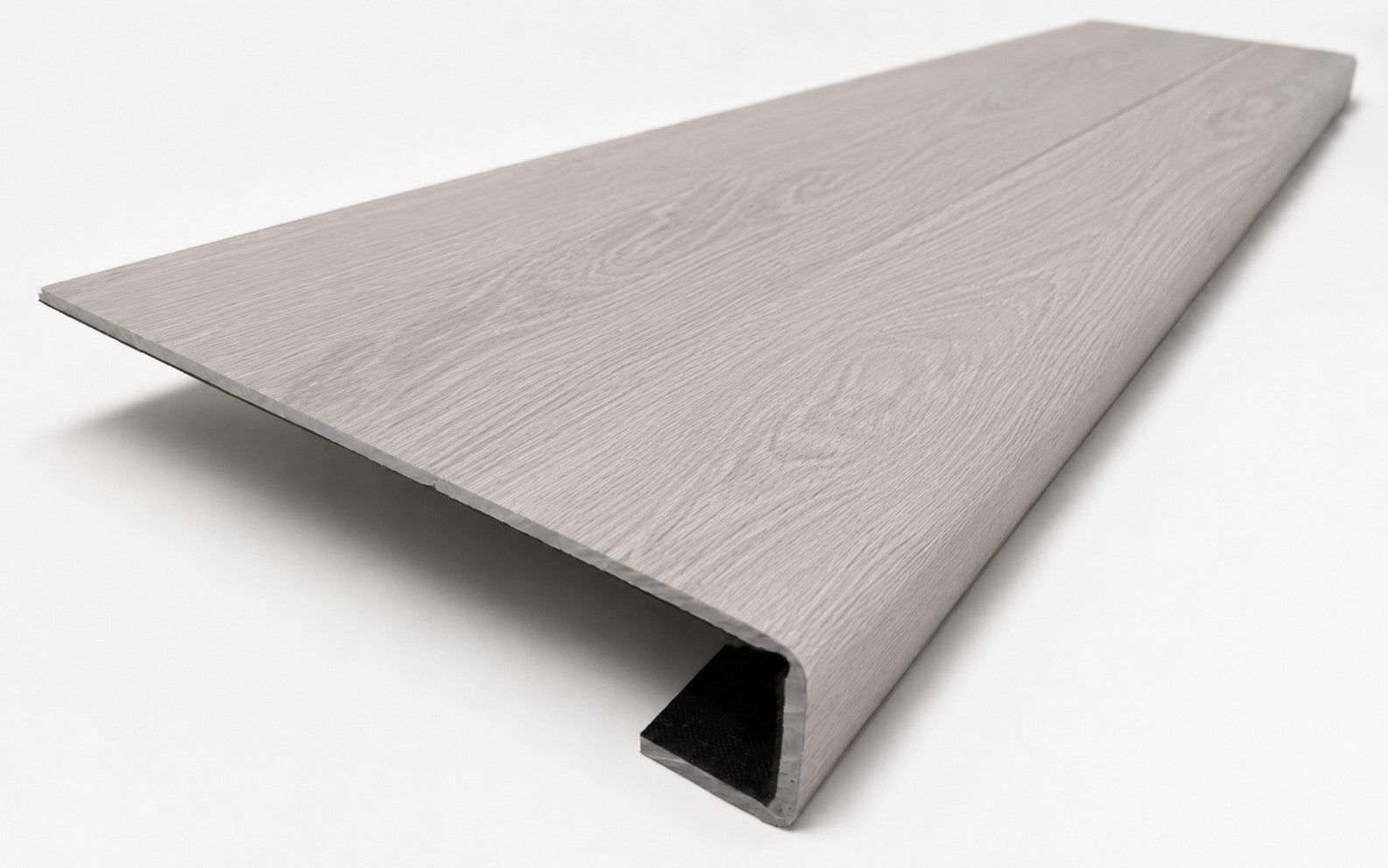 Custom square-nose stair tread made from NuCore Wisteria flooring. Square profile. Angled view.