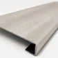 Custom square-nose stair tread made from STAINMASTER Port Isabel flooring. Square profile. Angled view.