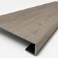 Custom square-nose stair tread made from Style Selections Ashen Oak flooring. Square profile. Angled view.