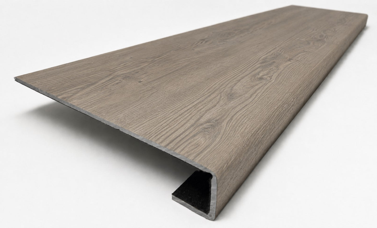 Custom square-nose stair tread made from Style Selections Ashen Oak flooring. Square profile. Angled view.