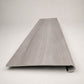 Custom round-nose stair tread made from Style Selections Charleston Oak flooring. Round profile. Front view.