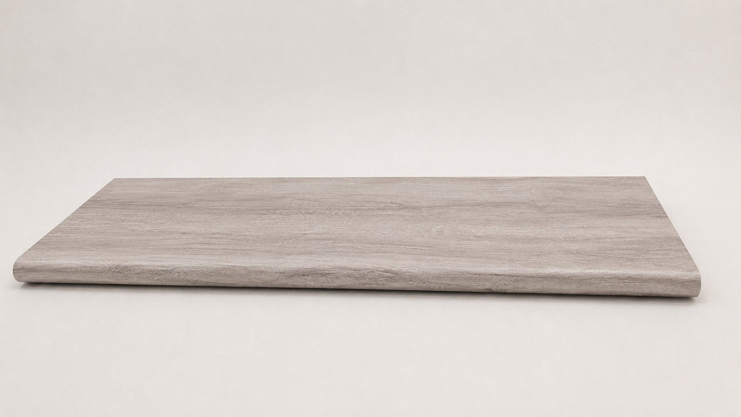 Custom round-nose stair tread made from Style Selections Charleston Oak flooring. Round profile. Full view.