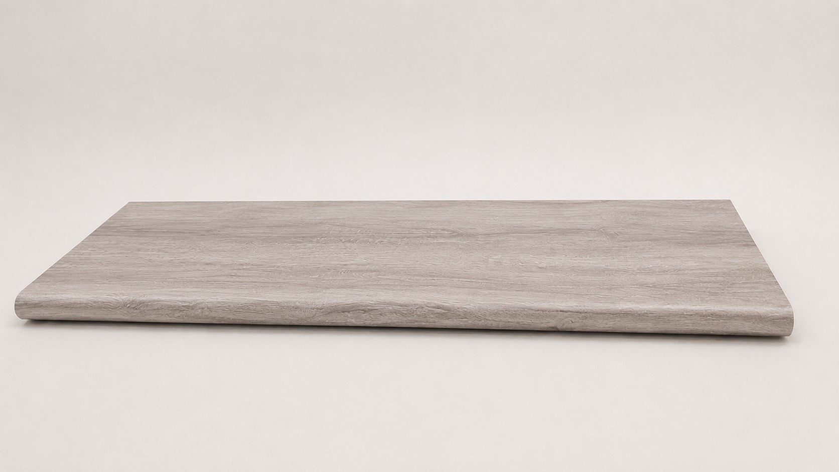 Custom round-nose stair tread made from Style Selections Charleston Oak flooring. Round profile. Full view.