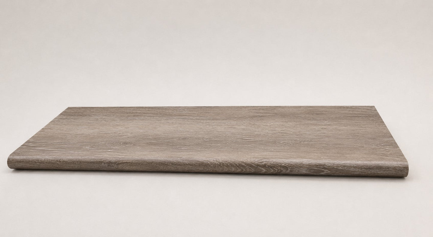 Custom round-nose stair tread made from Style Selections Dove Tail Oak flooring. Round profile. Full view.
