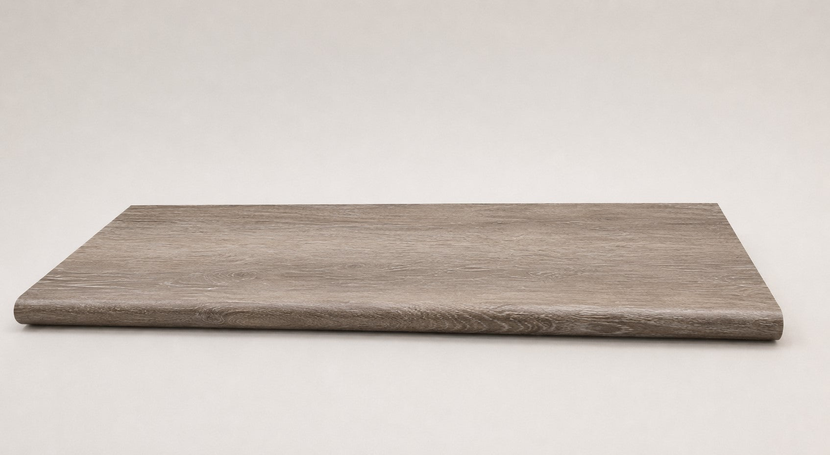 Custom round-nose stair tread made from Style Selections Dove Tail Oak flooring. Round profile. Full view.