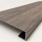 Custom square-nose stair tread made from Style Selections Dove Tail Oak flooring. Square profile. Angled view.