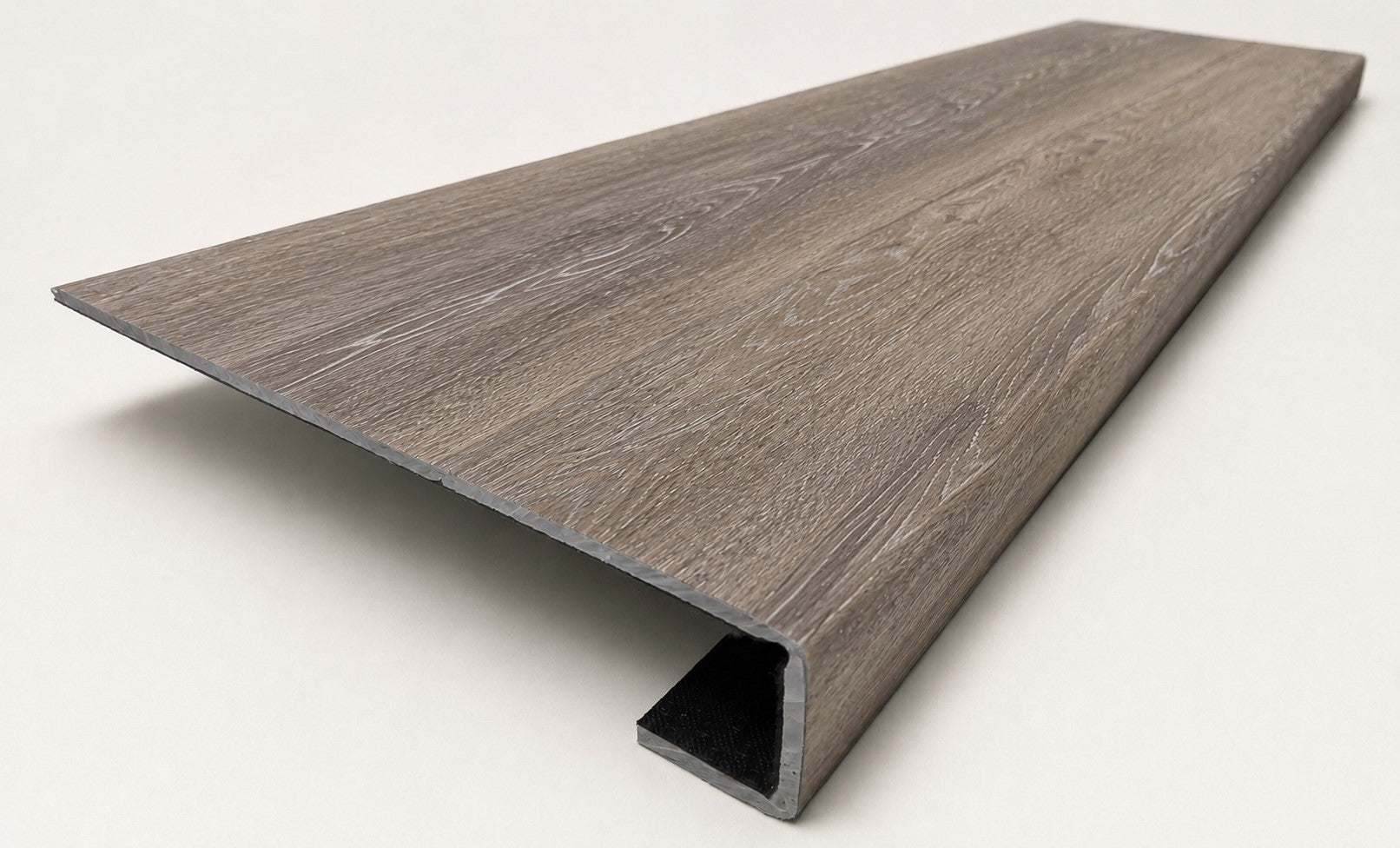 Custom square-nose stair tread made from Style Selections Dove Tail Oak flooring. Square profile. Angled view.