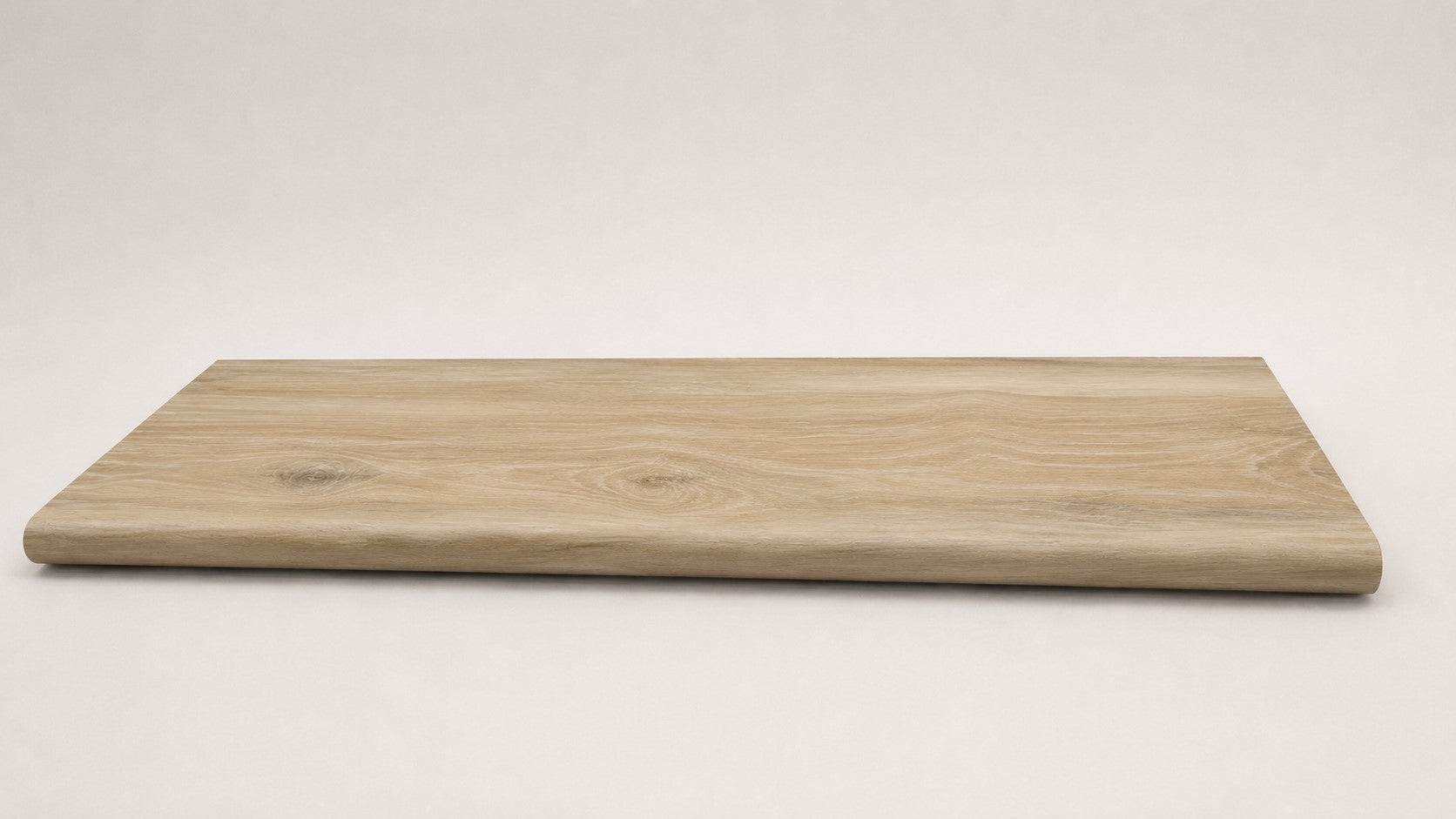 Custom round-nose stair tread made from Style Selections Natural Hickory flooring. Round profile. Full view.