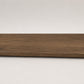Custom round-nose stair tread made from Style Selections Tudor Oak flooring. Round profile. Full view.