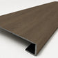 Custom square-nose stair tread made from Style Selections Tudor Oak flooring. Square profile. Angled view.
